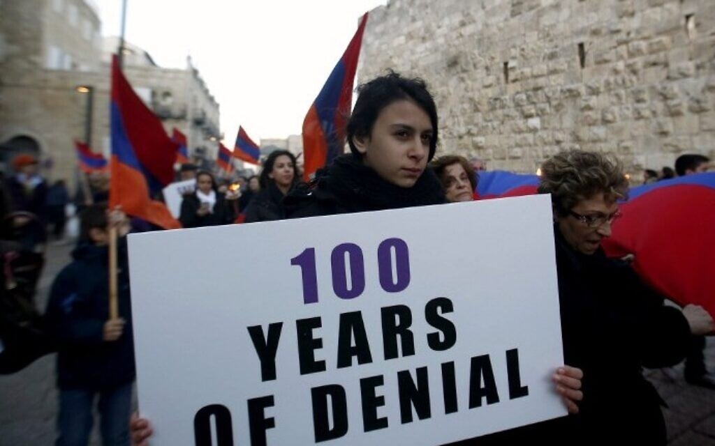Members of the Armenian community march with flags and torches on April 23, 2015, in Jerusalem's Old City, on the eve of the 100th anniversary of the mass killings of Armenians under the Ottoman Empire in 1915. (AFP/Gali Tibbon) Members of the Armenian community march with flags and torches on April 23, 2015, in Jerusalem's Old City, on the eve of the 100th anniversary of the mass killings of Armenians under the Ottoman Empire in 1915. (AFP/Gali Tibbon)