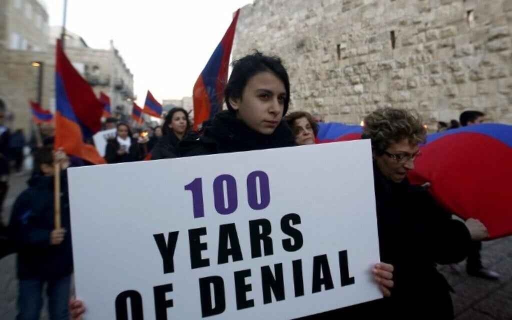 Members of the Armenian community march with flags and torches on April 23, 2015, in Jerusalem's Old City, on the eve of the 100th anniversary of the mass killings of Armenians under the Ottoman Empire in 1915. (photo credit: AFP/Gali Tibbon) Members of the Armenian community march with flags and torches on April 23, 2015, in Jerusalem's Old City, on the eve of the 100th anniversary of the mass killings of Armenians under the Ottoman Empire in 1915. (photo credit: AFP/Gali Tibbon)