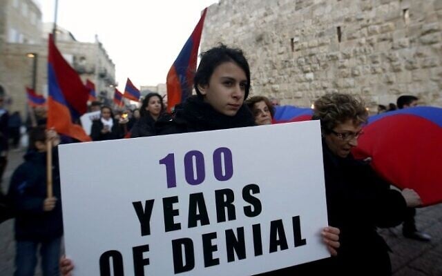 Members of the Armenian community march with flags and torches on April 23, 2015, in Jerusalem's Old City, on the eve of the 100th anniversary of the mass killings of Armenians under the Ottoman Empire in 1915. (photo credit: AFP/Gali Tibbon) Members of the Armenian community march with flags and torches on April 23, 2015, in Jerusalem's Old City, on the eve of the 100th anniversary of the mass killings of Armenians under the Ottoman Empire in 1915. (photo credit: AFP/Gali Tibbon)