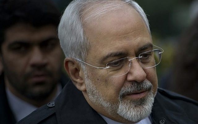Iranian Foreign Minister Javad Zarif is seen as he walks through a courtyard at the Beau Rivage Palace Hotel during an extended round of talks April 1, 2015, in Lausanne, Switzerland. (photo credit: AFP/BRENDAN SMIALOWSKI/POOL) 