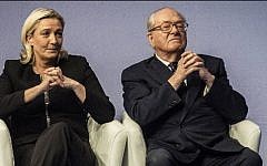 File - France's former far-right National Front party leader Jean-Marie Le Pen (R) and his daughter and current party leader Marine Le Pen (L) on November 29, 2014 (Jeff Pachoud/AFP)