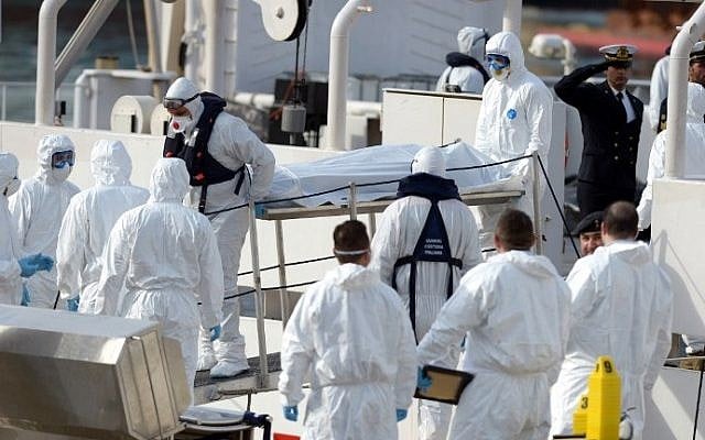 Italian Naval officers carry the body of a person who died after a fishing boat carrying migrants capsized off the Libyan coast, at Boiler Wharf, Senglea in Malta on April 20, 2015. (Matthew Mirabelli/AFP) Italian Naval officers carry the body of a person who died after a fishing boat carrying migrants capsized off the Libyan coast, at Boiler Wharf, Senglea in Malta on April 20, 2015. (Matthew Mirabelli/AFP)