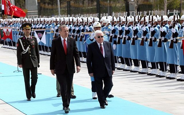 Turkish President Recep Tayyip Erdogan, left, and Iraqi President Fuad Masum, right, review the honor guard during an official welcoming ceremony prior to their meeting at the Presidential Palace in Ankara, on April 22, 2015. (photo credit: AFP/ADEM ALTAN)