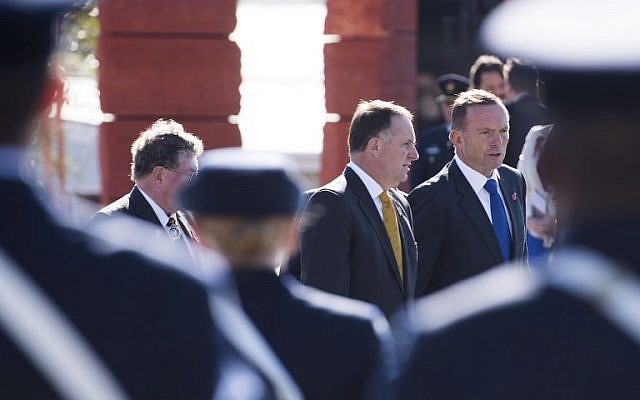 The Australian Prime Minister Tony Abbott (R) and Prime Minister of New Zealand John Key depart following the dedication of the Australia ANZAC memorial at Pukeahu National War Memorial Park in Wellington, New Zealand on APRIL 20, 2015. (photo credit: AFP/MARTY MELVILLE) The Australian Prime Minister Tony Abbott (R) and Prime Minister of New Zealand John Key depart following the dedication of the Australia ANZAC memorial at Pukeahu National War Memorial Park in Wellington, New Zealand on APRIL 20, 2015. (photo credit: AFP/MARTY MELVILLE)