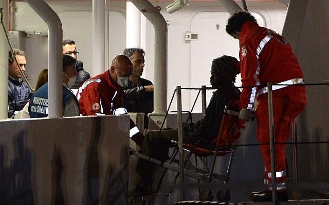Rescued migrants off the Libyan coast arrive at the harbor in Catania, Italy on April 20, 2015 (Photo credit: Alberto Pizzoli/AFP) Rescued migrants off the Libyan coast arrive at the harbor in Catania, Italy on April 20, 2015 (Photo credit: Alberto Pizzoli/AFP)