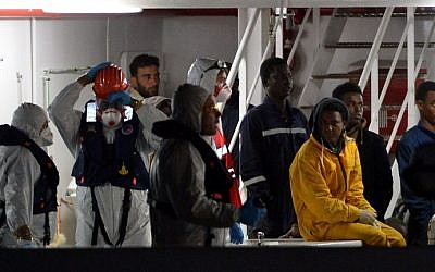 Illustrative: Rescued migrants off the Libyan coast arrive at the harbor in Catania, Italy on April 20, 2015. (Alberto Pizzoli/AFP)