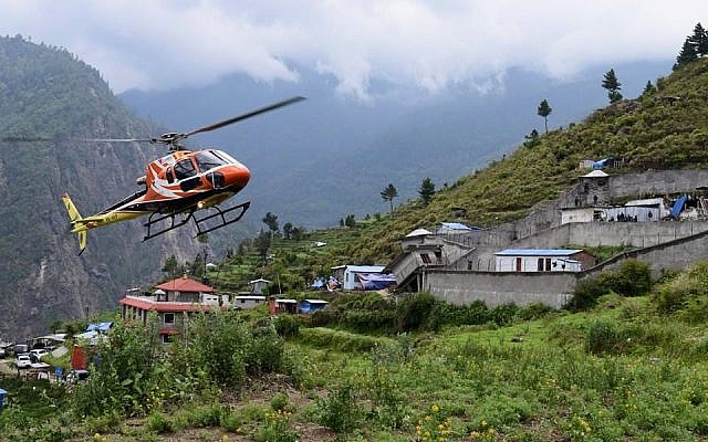 A helicopter searching for Israeli trekkers in the Langtang region of Nepal. ( photo credit: Chabad.org/Chabad of Nepal) A helicopter searching for Israeli trekkers in the Langtang region of Nepal. ( photo credit: Chabad.org/Chabad of Nepal)