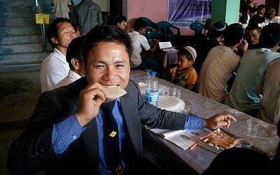 Hundreds of members of the Bnei Menashe community hold a model Passover seder in Churachandpur, in the Indian state of Manipur, Tuesday, March 31, 2015. (Jonathan Haukip/Shavei Israel)