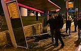 Police investigate the scene where a driver rammed his car into a bus stop in French Hill, Jerusalem, on April 15, 2015. (photo credit: Fire and Rescue Services)