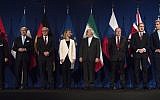 From left, Head of Mission of the People's Republic of China to the European Union Hailong Wu, French Foreign Minister Laurent Fabius, German Foreign Minister Frank Walter Steinmeier, European Union High Representative Federica Mogherini, Iranian Foreign Minister Javad Zarifat, Russian Deputy Political Director Alexey Karpov, British Foreign Secretary Philip Hammond and US Secretary of State John Kerry arrive in Lausanne, Switzerland, Thursday, April 2, 2015, after the United States, Iran and five other world powers on Thursday announced an understanding outlining limits on Iran's nuclear program. (AP Photo/Brendan Smialowski, Pool)