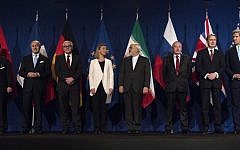 From left, Head of Mission of the People's Republic of China to the European Union Hailong Wu, French Foreign Minister Laurent Fabius, German Foreign Minister Frank Walter Steinmeier, European Union High Representative Federica Mogherini, Iranian Foreign Minister Javad Zarifat, Russian Deputy Political Director Alexey Karpov, British Foreign Secretary Philip Hammond and US Secretary of State John Kerry arrive in Lausanne, Switzerland, Thursday, April 2, 2015, after the United States, Iran and five other world powers on Thursday announced an understanding outlining limits on Iran's nuclear program. (AP Photo/Brendan Smialowski, Pool)