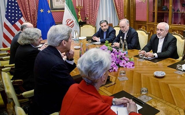 From left: Robert Malley, of the US National Security Council, US Secretary of Energy Ernest Moniz, US Secretary of State John Kerry, US Under Secretary for Political Affairs Wendy Sherman, Iranian Deputy Foreign Minister Abbas Araghchi, Head of Iranian Atomic Energy Organization Ali Akbar Salehi and Iranian Foreign Minister Mohammad Javad Zarif wait for a meeting, Friday, March 27, 2015 in Lausanne, Switzerland (photo credit: AP/Brendan Smialowski)