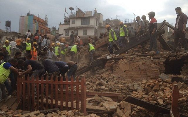 Rescuers clear the debris at Durbar Sqaure after an earthquake in Kathmandu, Nepal, Saturday, April 25, 2015. (Photo credit: AP/ Niranjan Shrestha) Rescuers clear the debris at Durbar Sqaure after an earthquake in Kathmandu, Nepal, Saturday, April 25, 2015. (Photo credit: AP/ Niranjan Shrestha)