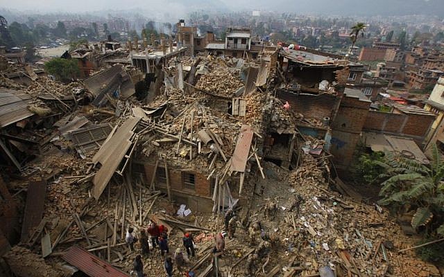 Rescue workers remove debris as they search for victims of the earthquake in Bhaktapur near Kathmandu, Nepal, April 26, 2015. (photo credit: AP/Niranjan Shrestha) Rescue workers remove debris as they search for victims of the earthquake in Bhaktapur near Kathmandu, Nepal, April 26, 2015. (photo credit: AP/Niranjan Shrestha)