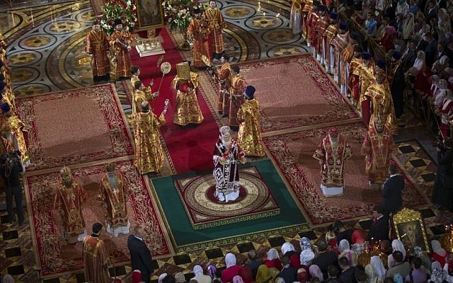 Russian Orthodox Patriarch Kirill, center, conducts the Easter service in Christ the Savior Cathedral in Moscow, Russia, April 12, 2015. (photo credit: AP/Alexander Zemlianichenko, Pool)