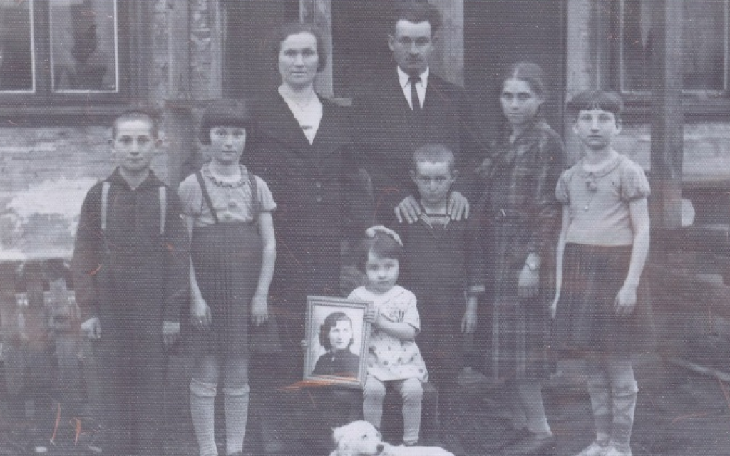 This undated photograph of the Achun family shows Yocheved holding a photograph of her Aunt Ruth, who was tormented by the presumed Holocaust deaths of these relatives. (Courtesy of Audrey Greenberg/JTA) This undated photograph of the Achun family shows Yocheved holding a photograph of her Aunt Ruth, who was tormented by the presumed Holocaust deaths of these relatives. (Courtesy of Audrey Greenberg/JTA)