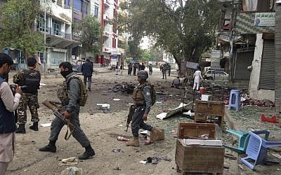 Illustrative photo of Afghan security forces inspecting the site of a suicide attack near a new Kabul Bank in Jalalabad, east of Kabul, Afghanistan, Saturday, April, 18, 2015. (AP)