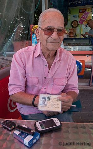 Arieh Kalenski, 73, at the Mifgash Shiri lottery booth, on Brodetski Street in Tel Aviv, lives in Herzliya: "...masochism is in human nature" (Photo credit: Judith Hertog) 