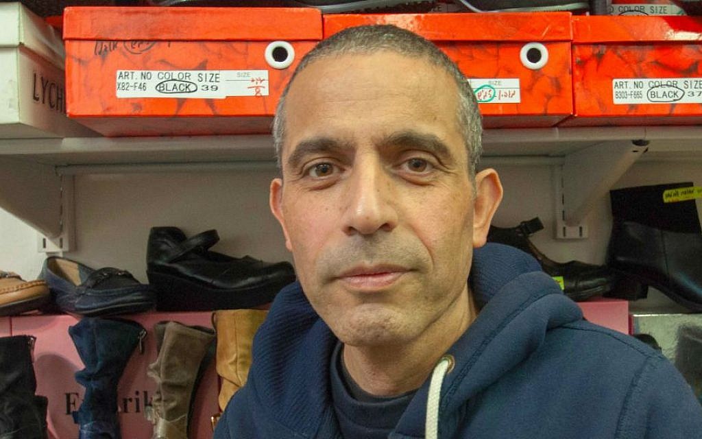 Beni Bengi, 47, at Frederika Shoes, Sokolov Street, Herzliya, lives in Kfar Saba: "I have already started over once, and I don't want to do it again." (Photo credit: Judith Hertog)