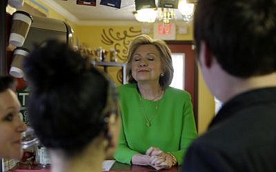 Democratic presidential candidate Hillary Rodham Clinton meets with local residents at the Jones St. Java House, Tuesday, April 14, 2015, in LeClaire, Iowa. (photo credit: AP/Charlie Neibergall) Democratic presidential candidate Hillary Rodham Clinton meets with local residents at the Jones St. Java House, Tuesday, April 14, 2015, in LeClaire, Iowa. (photo credit: AP/Charlie Neibergall)