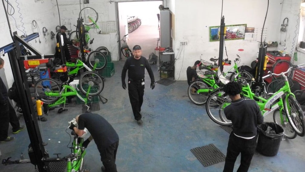 Ten mechanics try to give each bike a tune-up at least once a month. Flat tires account for 50 percent of the work, leading the company to experiment with airless tires. (photo credit: Melanie Lidman/Times of Israel)