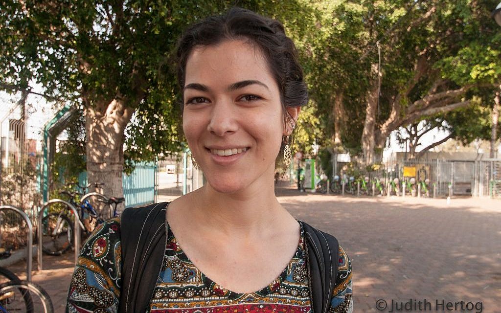 Alumah L., 24, on the 480 bus from Jerusalem to Tel Aviv, lives in Jerusalem: When you read an ancient text, it actually talks to you." (Photo credit: Judith Hertog)