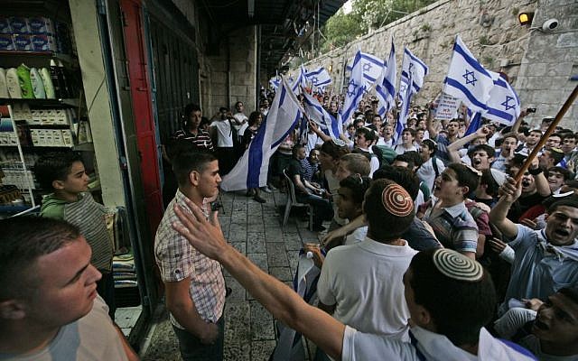 Israeli youth chant outside an Arab store in the Old City during Jerusalem Day's 'flag march,' May 21, 2009. (photo credit: Abir Sultan/Flash90) Israeli youth chant outside an Arab store in the Old City during Jerusalem Day's 'flag march,' May 21, 2009. (photo credit: Abir Sultan/Flash90)