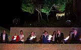 Illustrative: Survivors, some accompanied by their children or grandchildren, light six torches at Yad Vashem on the eve of Holocaust Remembrance Day in 2017. (Yonatan Sindel/ Flash 90)