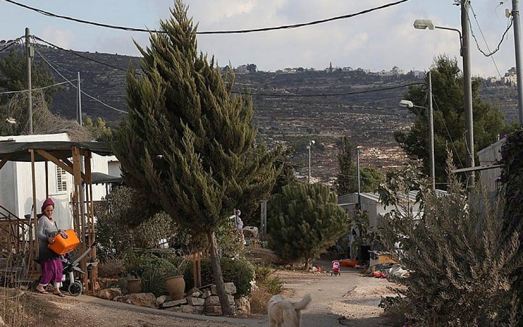 Illustrative photo: A settler walking near her house in the Jewish settlement of Bat Ayin in the West Bank on September 15, 2014. (Photo credit: Nati Shohat/Flash90)
