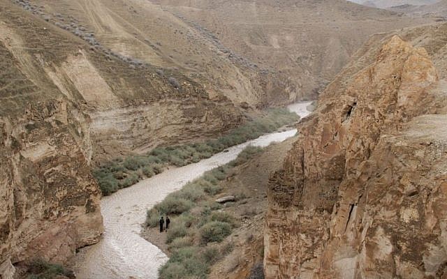Illustrative photo of Israelis watching flash floods in Nahal Og, which empties into the Dead Sea, November 26, 2014. (Maxim Dinshtein/Flash90) Illustrative photo of Israelis watching flash floods in Nahal Og, which empties into the Dead Sea, November 26, 2014. (Maxim Dinshtein/Flash90)