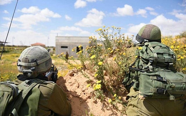 Soldiers practice in an IDF drill in the Gaza border Division on March 22, 2015. The drill was meant to reenact scenarios following lessons learnt from last summer's Operation Protective Edge (photo credit: IDF spokesman) Soldiers practice in an IDF drill in the Gaza border Division on March 22, 2015. The drill was meant to reenact scenarios following lessons learnt from last summer's Operation Protective Edge (photo credit: IDF spokesman)