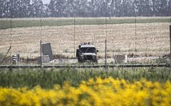 An Israeli military vehicle on standby near the border between Israel and the Gaza Strip on March 30, 2015 (Abed Rahim Khatib/Flash90)