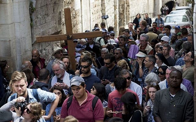 Christian Catholic worshipers hold crosses as they take part in a Good Friday procession, during the holiday of Easter, on the Via Dolorsa in Jerusalem's Old City on April 03, 2015. (photo credit: Danielle Shitrit/Flash90)