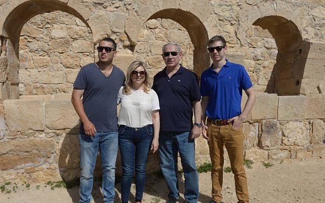 Prime Minister Benjamin Netanyahu and his wife Sara tour southern Israel together on April 8, 2015 together with their sons Yair and Avner, during the Jewish holiday of Passover. (Photo credit: Amos Ben Gershom/GPO)