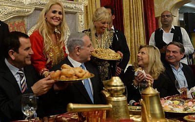 Prime Minister Benjamin Netanyahu and his wife Sara attend a Mimouna celebration in Or Akiva on April 11, 2015. (Kobi Gideon / GPO)