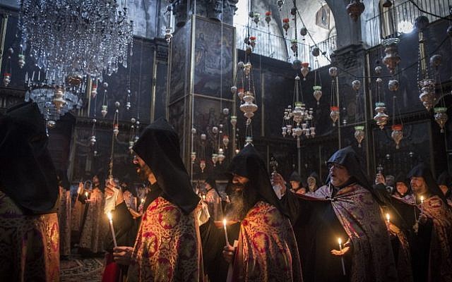 .Armenian priests hold Easter Sunday prayers at the Saint James Armenian Church in the Armenian Quarter of Jerusalem's Old City, on April 12, 2015. (Hadas Parush/Flash90)