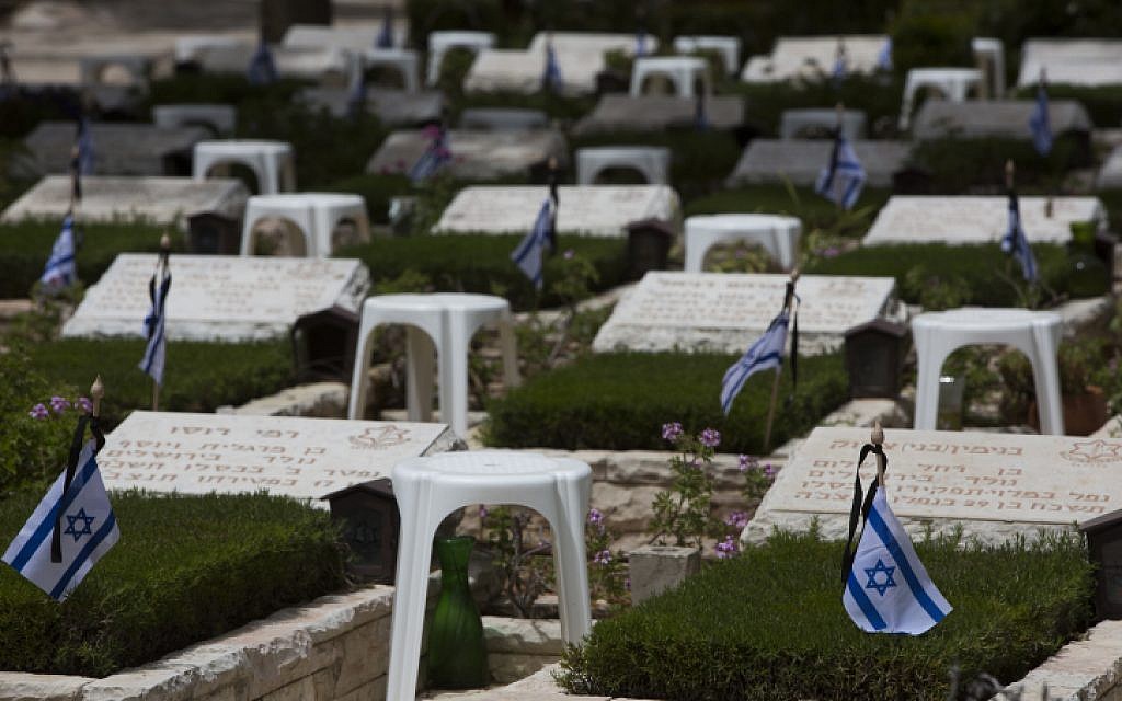 Israeli flags seen on the graves of fallen Israeli soldiers at Mount Herzl Military Cemetery in Jerusalem on April 20, 2015 (Photo credit: Yonatan Sindel/Flash90)