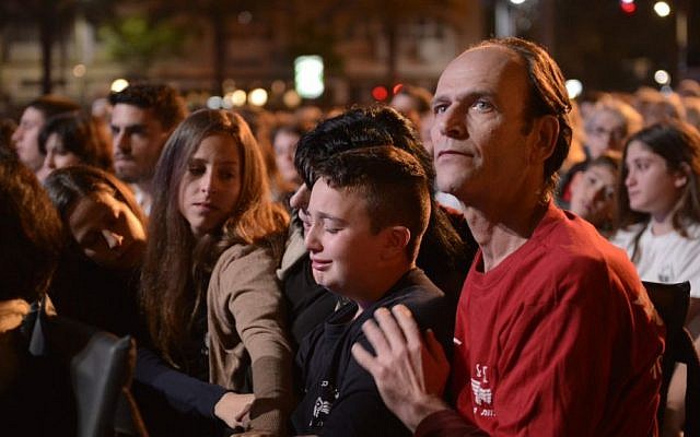 Friends and family of IDF soldier Roy Peles, who was killed last summer in combat in the Gaza Strip during Operation Protective Edge attend a Memorial Day event at Rabin square in Tel Aviv, April 21, 2015. (Danielle Shitrit/Flash90)