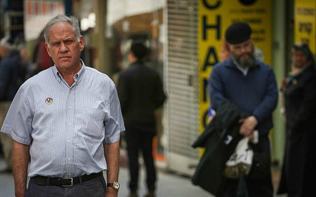 Israelis stand still as a two-minute siren sounds across Israel marking Memorial Day for fallen soldiers and terror victims, Jerusalem, April 22, 2015. (Hadas Parush/Flash90)