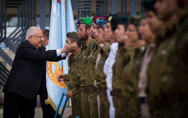 Israeli President Reuven Rivlin jokes with soldiers as he inspects the ranks during a ceremony for outstanding servicemen as part of Israel's 67th Independence Day celebrations on April 23, 2015 at the President's residence in Jerusalem. (Photo credit: Miriam Alster / Flash90) Israeli President Reuven Rivlin jokes with soldiers as he inspects the ranks during a ceremony for outstanding servicemen as part of Israel's 67th Independence Day celebrations on April 23, 2015 at the President's residence in Jerusalem. (Photo credit: Miriam Alster / Flash90)