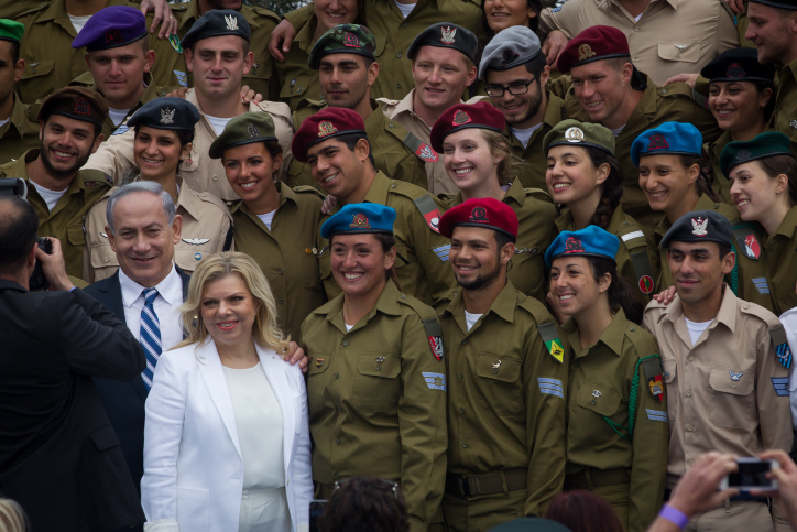Israeli soldiers pose with Prime Minister Benjamin Netanyahu and his wife Sara after a ceremony honoring outstanding soldiers at the President's residence in Jerusalem as part of Israel's 67th Independence Day celebrations on April 23, 2015. (Photo credit: Miriam Alster / Flash90) Israeli soldiers pose with Prime Minister Benjamin Netanyahu and his wife Sara after a ceremony honoring outstanding soldiers at the President's residence in Jerusalem as part of Israel's 67th Independence Day celebrations on April 23, 2015. (Photo credit: Miriam Alster / Flash90)