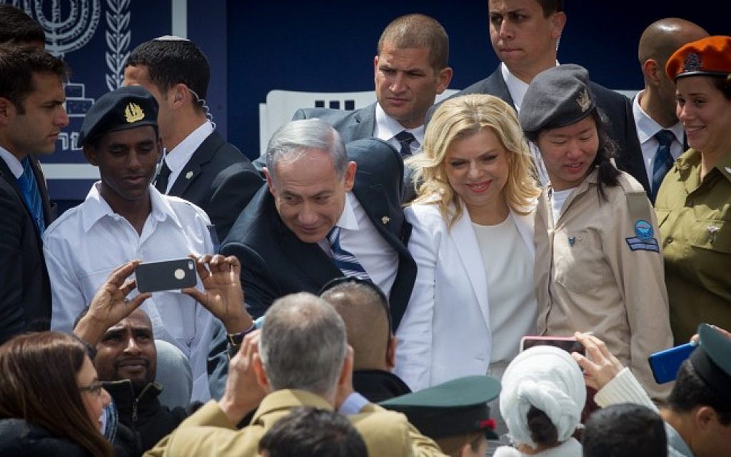 Prime minister Benjamin Netanyahu and his wife Sara are greeted by Israeli soldiers at a ceremony for outstanding soldiers as part of Israel's 67th Independence Day celebrations, at the President's residence in Jerusalem. April 23, 2015 (Photo credit: Miriam Alster/Flash90)