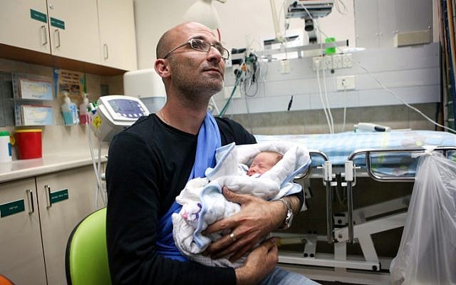 Omri Lancet and his son seen at the Soroka hospital in the southern Israeli city of Beersheba upon arrival from Nepal on April 26, 2015. (photo credit: Flash90) Omri Lancet and his son seen at the Soroka hospital in the southern Israeli city of Beersheba upon arrival from Nepal on April 26, 2015. (photo credit: Flash90)