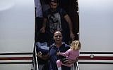Survivors of the massive earthquake in Nepal a few days ago arrive at Sde Dov Airport in Tel Aviv on a Magen David Adom aircraft, April 27, 2015. (photo credit: Tomer Neuberg/Flash90)