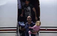 Survivors of the massive earthquake in Nepal a few days ago arrive at Sde Dov Airport in Tel Aviv on a Magen David Adom aircraft, April 27, 2015. (photo credit: Tomer Neuberg/Flash90)