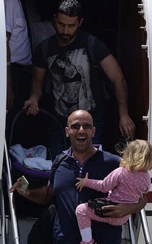 Survivors of the massive earthquake in Nepal a few days ago arrive at Sde Dov Airport in Tel Aviv on a Magen David Adom aircraft, April 27, 2015. (photo credit: Tomer Neuberg/Flash90) Survivors of the massive earthquake in Nepal a few days ago arrive at Sde Dov Airport in Tel Aviv on a Magen David Adom aircraft, April 27, 2015. (photo credit: Tomer Neuberg/Flash90)