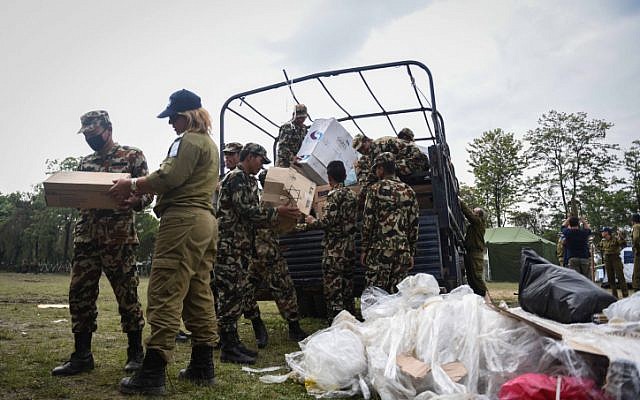 Israeli and Nepalese soldiers set up a field hospital in Kathmandu on April 29, 2015 after a deadly earthquake struck the Nepalese capital. (photo credit: IDF Spokesperson) Israeli and Nepalese soldiers set up a field hospital in Kathmandu on April 29, 2015 after a deadly earthquake struck the Nepalese capital. (photo credit: IDF Spokesperson)