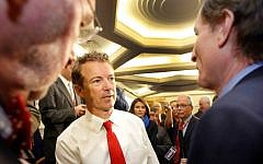 Republican presidential hopeful Sen. Rand Paul, R-Ky., shakes hands after speaking at the Republican Leadership Summit Saturday, April 18, 2015, in Nashua, NH. (AP Photo/Jim Cole)