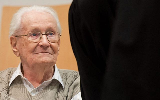Defendant Oskar Groening sits in the dock of the court in Lueneburg, northern Germany, Tuesday, April 21, 2015. The 93-year-old former Auschwitz guard faces trial on 300,000 counts of accessory to murder, in a case that will test the argument that anyone who served at a Nazi death camp was complicit in what happened there. (photo credit: Julian Stratenschulte/Pool Photo via AP) Defendant Oskar Groening sits in the dock of the court in Lueneburg, northern Germany, Tuesday, April 21, 2015. The 93-year-old former Auschwitz guard faces trial on 300,000 counts of accessory to murder, in a case that will test the argument that anyone who served at a Nazi death camp was complicit in what happened there. (photo credit: Julian Stratenschulte/Pool Photo via AP)