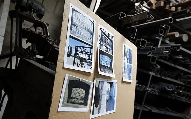 Construction plans hang in a workshop of blacksmith Michael Poitner as he works on a replica of the Dachau Nazi concentration camp gate with the writing "Arbeit macht frei" (Work Sets you Free) in Biberbach near Dachau, Germany, Thursday, April 16, 2015. The original gate was stolen in November 2014. (AP Photo/Matthias Schrader) Construction plans hang in a workshop of blacksmith Michael Poitner as he works on a replica of the Dachau Nazi concentration camp gate with the writing "Arbeit macht frei" (Work Sets you Free) in Biberbach near Dachau, Germany, Thursday, April 16, 2015. The original gate was stolen in November 2014. (AP Photo/Matthias Schrader)